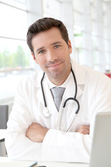 Portrait of young doctor at work