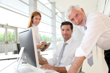 Office workers with manager in a meeting