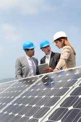 Engineers checking solar panels setup