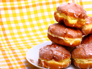 Delicious dessert made of several glazed donuts
