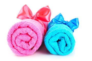 Obraz na płótnie Canvas Twisted blue and pink towels with bands isolated on white