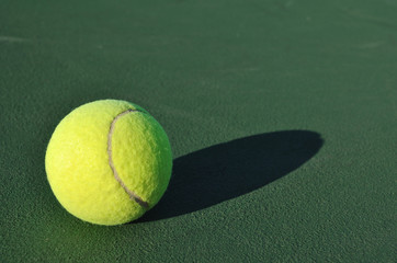 Yellow Tennis Ball on Court