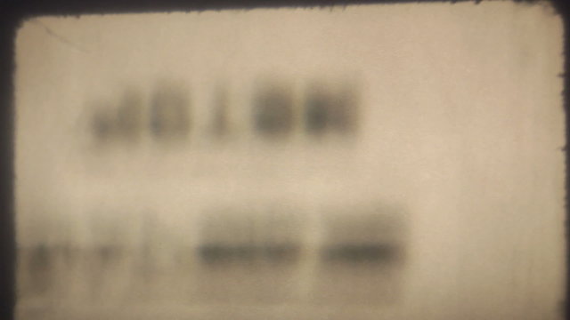 Close-up macro shot of actual 8mm film projector gate.