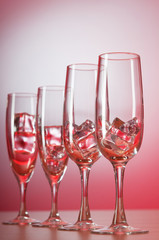 Glasses of water against gradient background