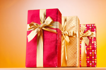 Celebration concept - Gift box against colorful background