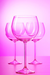 Wine glasses against gradient background