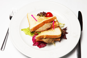 Sandwich with beef on a white plate
