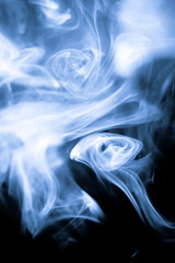 strangely shaped puff of smoke on black