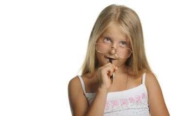 Naklejka premium The thoughtful girl the blonde in glasses and with pen