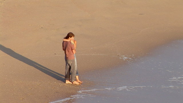 Young cupple hugging on the beach