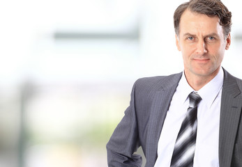 Fototapeta premium Portrait of a happy successful mature business man