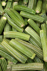 Fresh chopped Roman zucchinis on display at an Italian outdoors