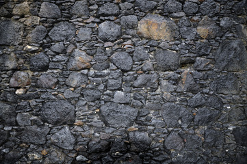 Muro de piedra volcánica