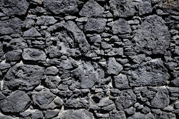 Pared de piedra volcánica