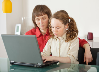 Mom and daughter with laptop