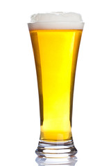 Glass of ice cold beer isolated on white background