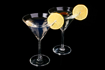 Martini glasses on black background
