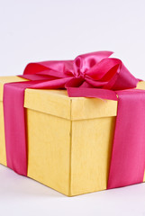 yelloy present box with ribbon bow