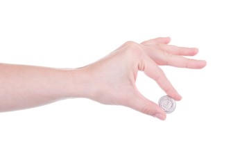 One Zloty coin in female hand isolated