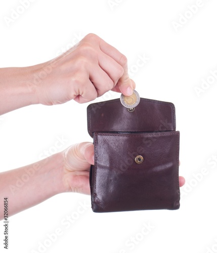 Female Hand Putting Polish Zloty Coin Into Purse Stock Photo And Female Hand Putting Polish Zloty Coin Into Purse Stock Photo And