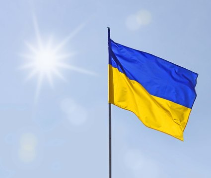 A sun above the flag of Ukraine