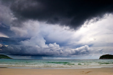 Beautiful tropical beach under gloomy sky.