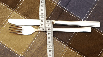 knife and fork on textile napkin. diet healthy food