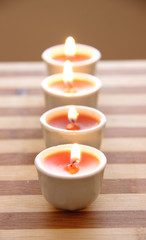 Fototapeta na wymiar Candles on bamboo board