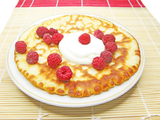 pancake with sour cream and raspberry