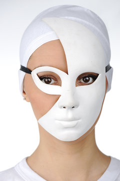 Portrait of a beautiful girl with white mask