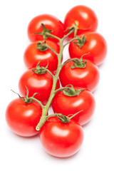 Stem of fresh ripe cherry tomatoes isolated on white background