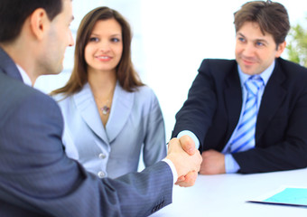 Business people shaking hands, finishing up a meeting