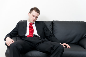 a young man sitting on the couch