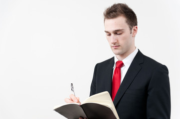 young businessman checking his schedule