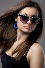 Portrait of attractive young woman in glasses