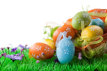 color easter eggs in basket isolated on white