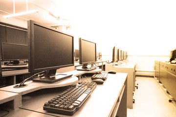 workplace room with computers in row