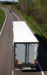 White  truck driving on country-road