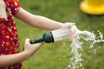 girl playing with water