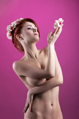 Obraz na płótnie Canvas Beauty naked girl with flower and garland