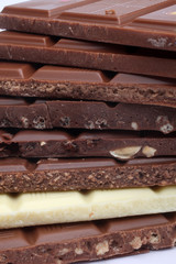 Close up of chocolate pieces on white background