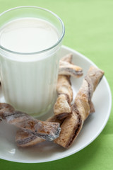A glass of milk, and tasty cookies