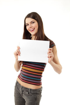 teen girl holding blank white paper closeup isolated on white ba