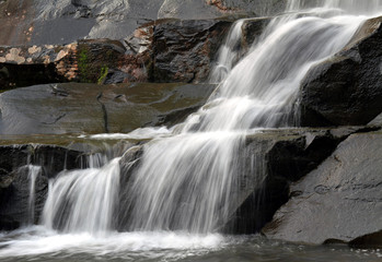 Waterfall at Kaaterskill Falls in Rock Glen. Water is veiled.