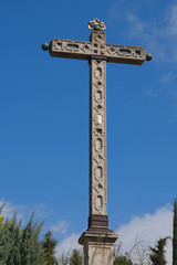 Stone Cross on blue sky