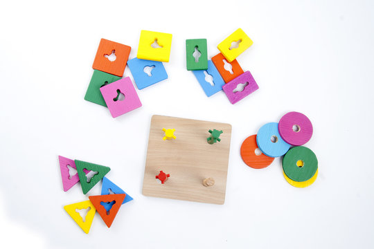Wooden toy pieces on White Background