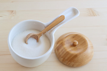 Sugar bowl with a wooden spoon and lid