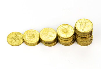 Stack of gold coins isolated on white