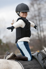 Horse riding - little girl stunt riding