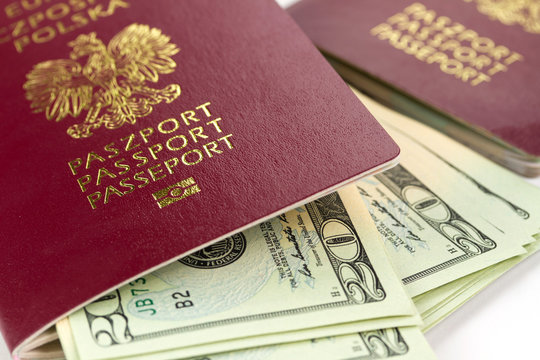 Passports and money over white background
